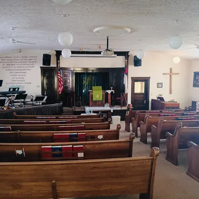Sanctuary view with pulpit and wooden cross