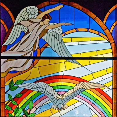 Stained glass angel and dove with rainbow