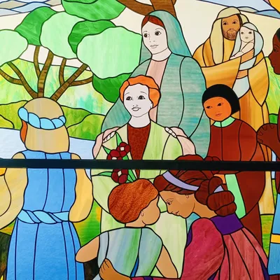 Stained glass depicting community of people